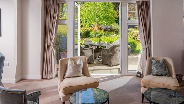 a living room with a large glass door