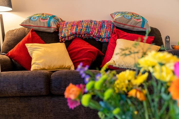 a couch with colorful pillows