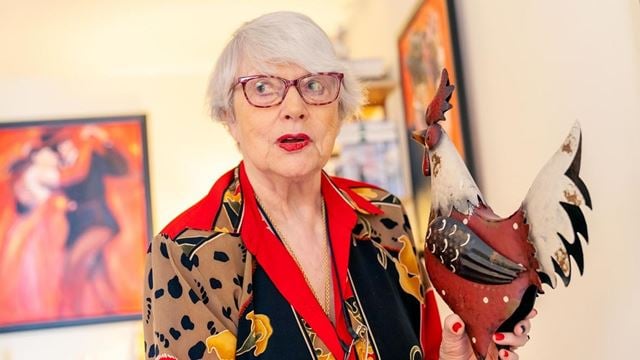 a woman holding a couple of fish