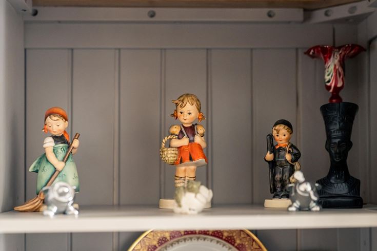a group of figurines on a shelf