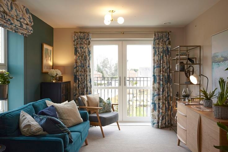a living room with a blue couch