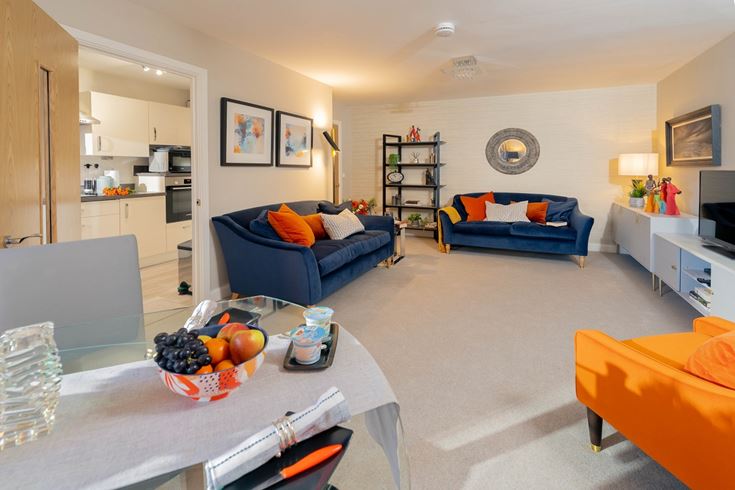 a living room with a couch and a table