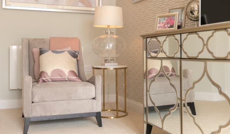 a room with a couch and a lamp