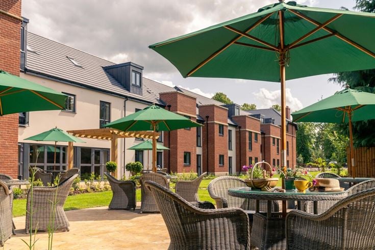 McCarthy & Stone retirement flat overlooking a shared outdoor area.