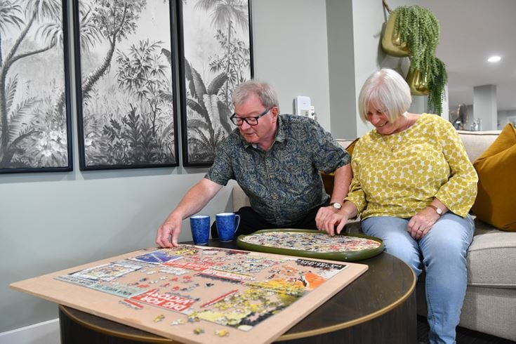 Seniors Lesley and Ian do a jigsaw while enjoy the benefits of Shared Ownership, Rugby, Warwickshire