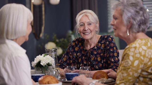 a few women sitting at a table