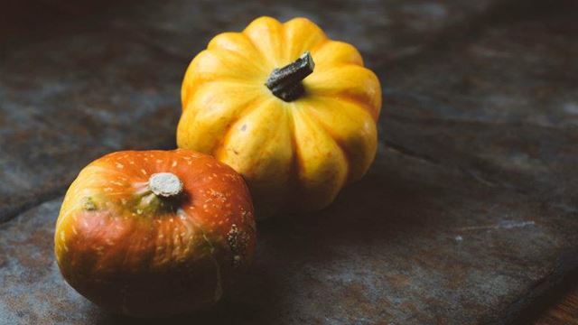 a couple of oranges with a face on them