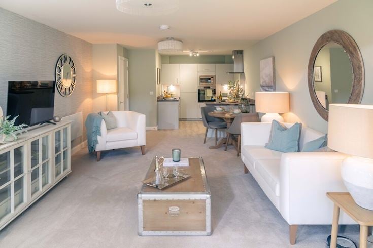 a living room with a couch and a table