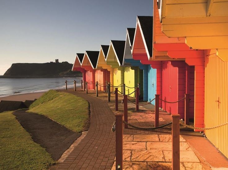 a row of colorful buildings by the water