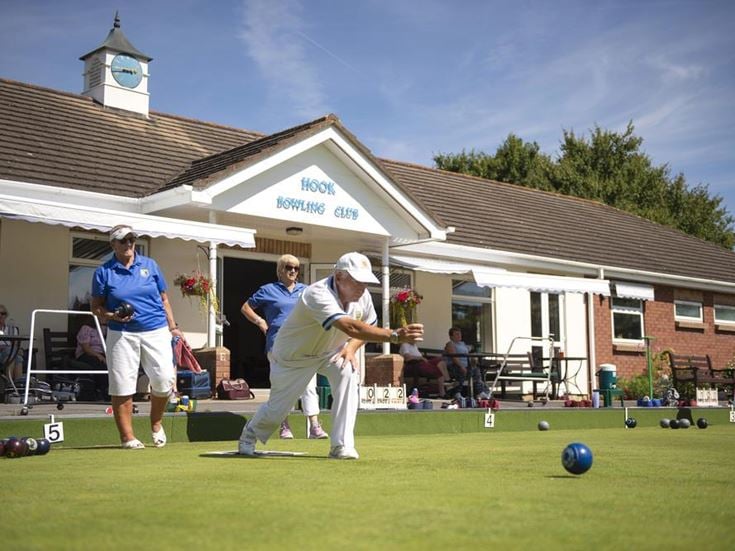 a group of people playing a game of golf