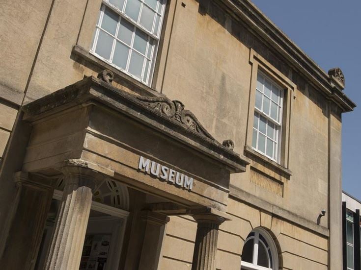 a building with windows and a sign on the front