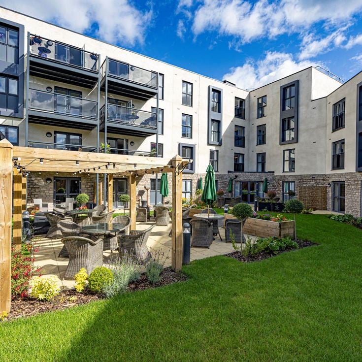 a building with a play structure in the front
