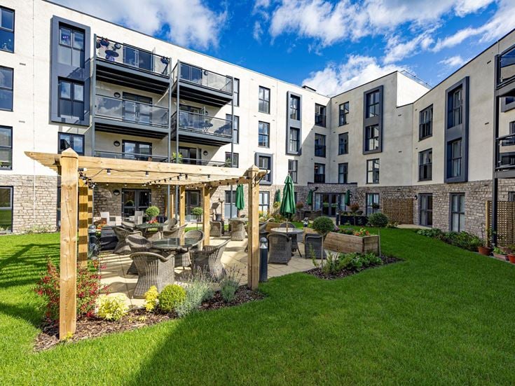 a building with a play structure in the front