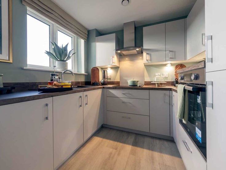 a kitchen with white cabinets