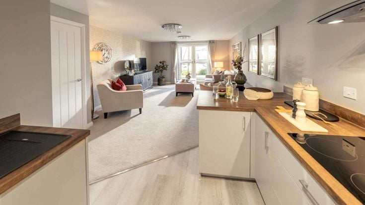 a kitchen with a sink and a couch