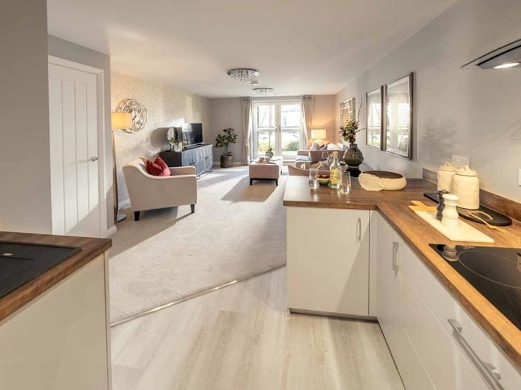 a kitchen with a sink and a couch
