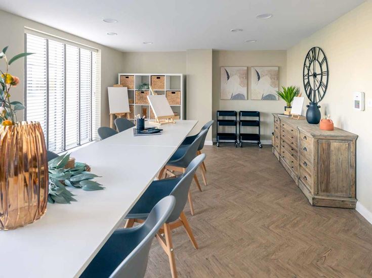 a large room with a table and chairs