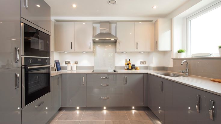 a kitchen with black appliances