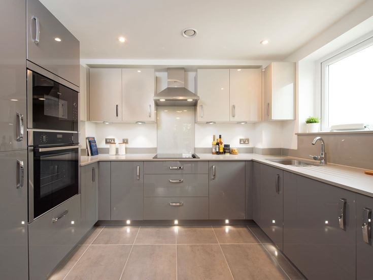 a kitchen with black appliances