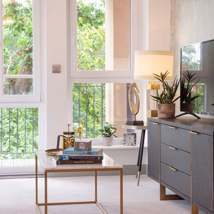 a kitchen with a table and a window