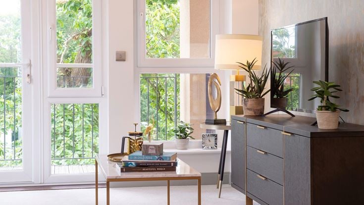 a kitchen with a table and a window