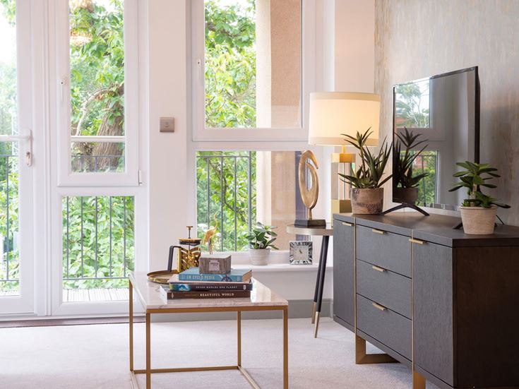 a kitchen with a table and a window