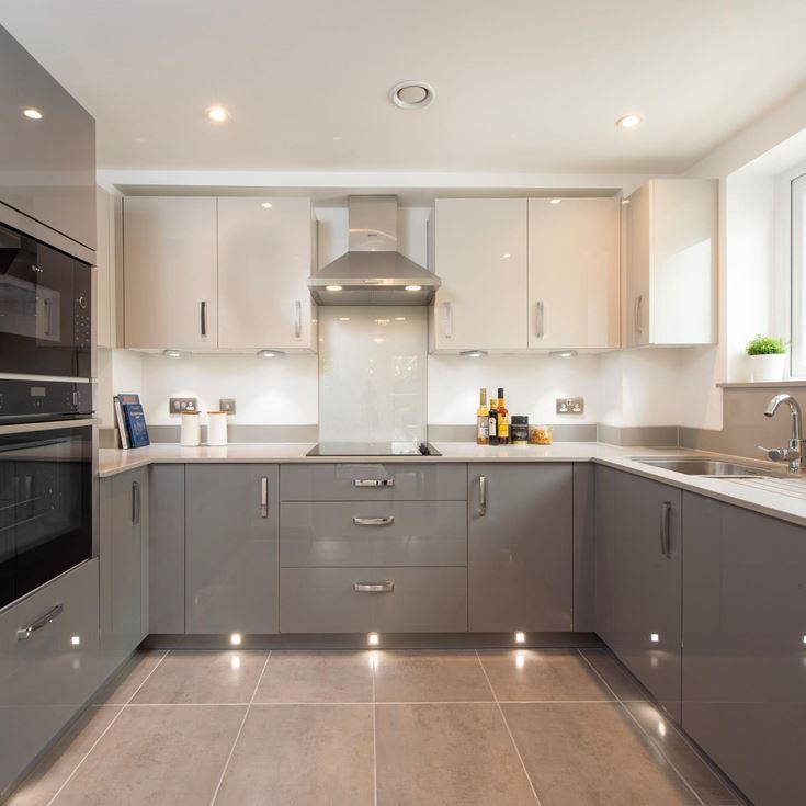 a kitchen with white cabinets