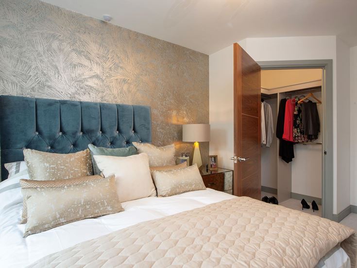 a bedroom with a bed and a closet