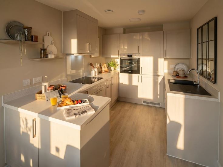 a kitchen with white cabinets