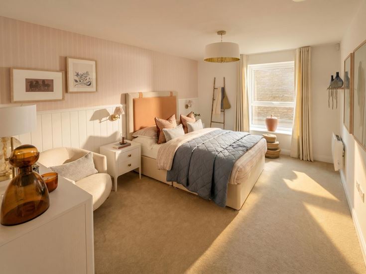 a bedroom with a bed and a chair