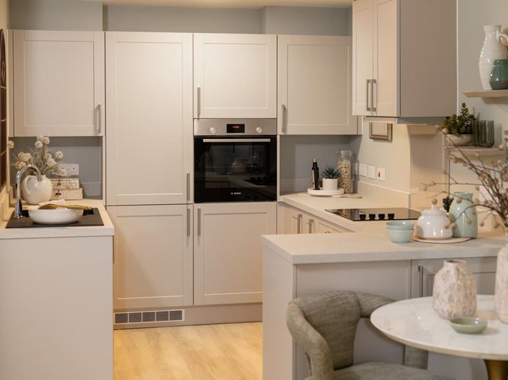 a kitchen with white cabinets