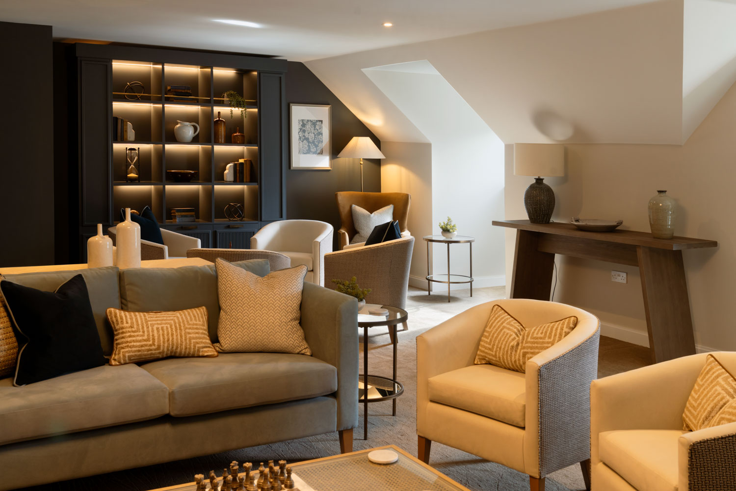 a living room with a couch and chairs