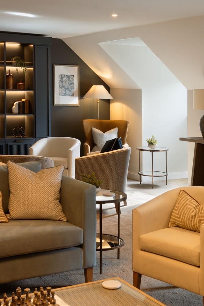 a living room with a couch and chairs