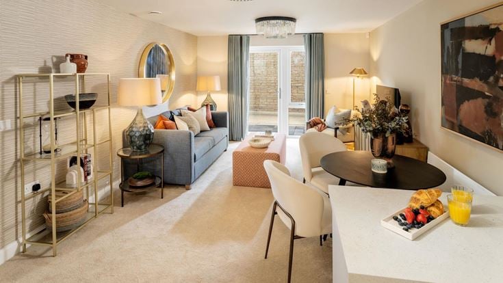 a living room with a white couch and a table