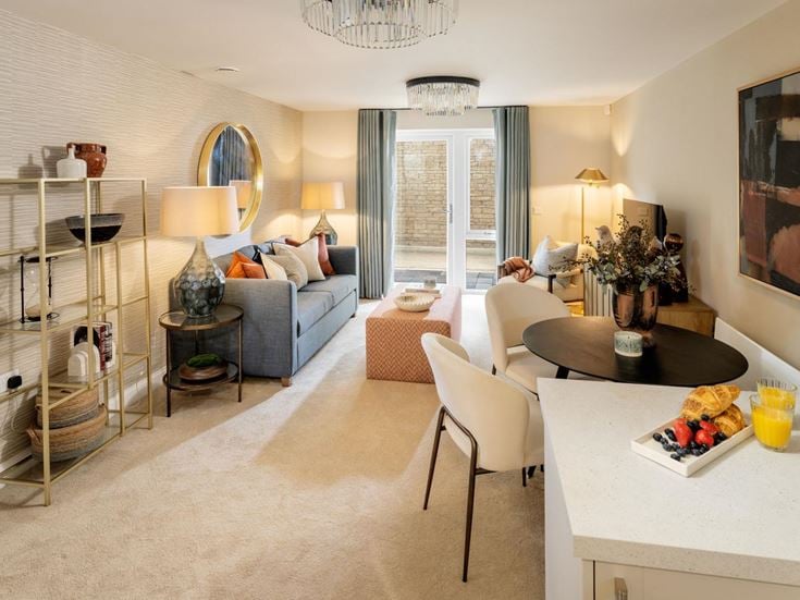a living room with a white couch and a table