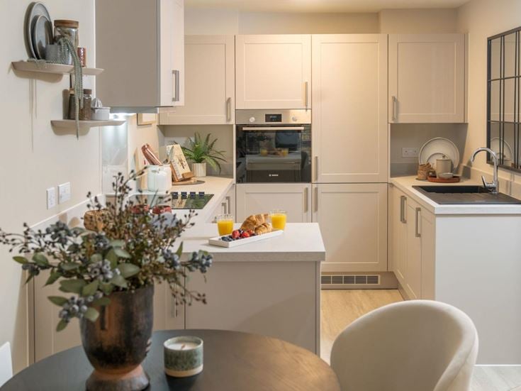 a kitchen with white cabinets