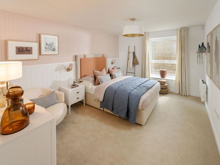 a bedroom with a bed and a chair