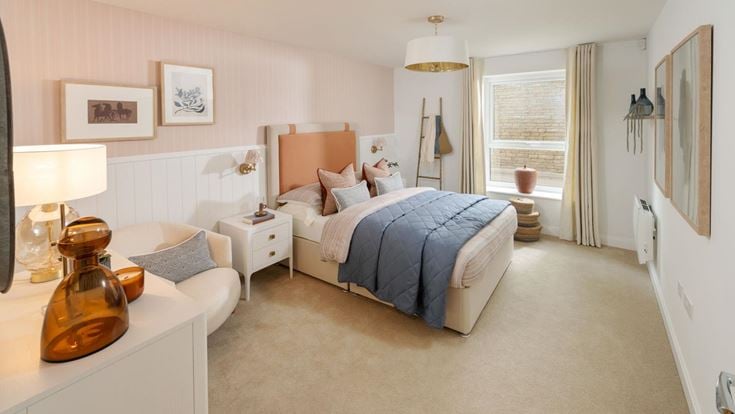 a bedroom with a bed and a chair