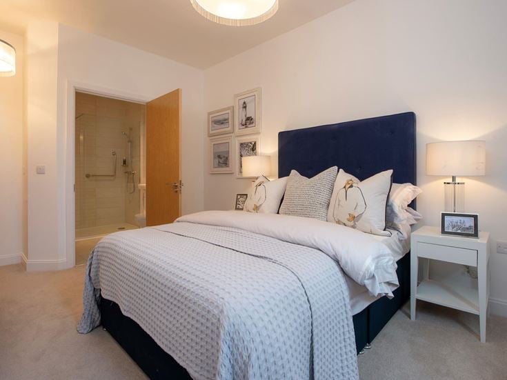 a bed with white sheets