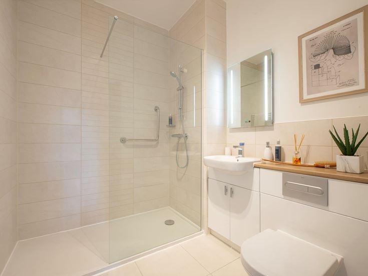 a bathroom with a shower and sink