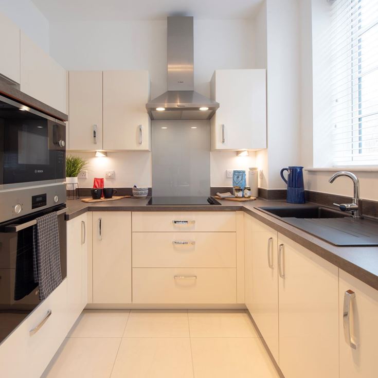 a kitchen with white cabinets
