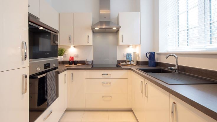 a kitchen with white cabinets