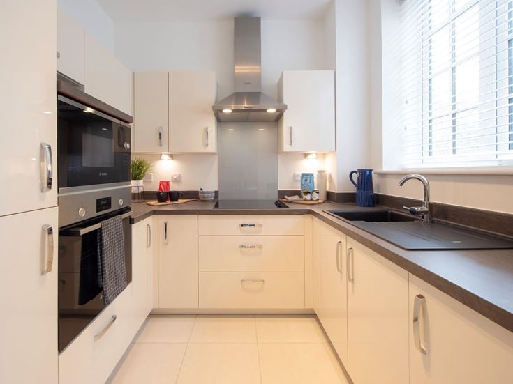 a kitchen with white cabinets
