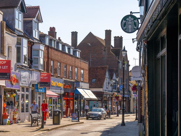 a street with buildings and people