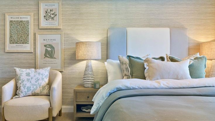 a room with a bed and a chair