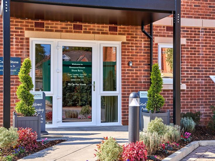 a brick building with glass doors