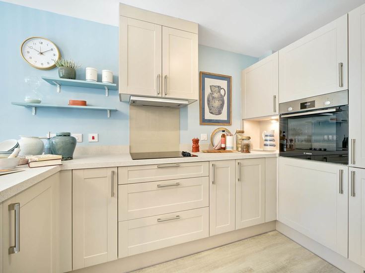 a kitchen with white cabinets