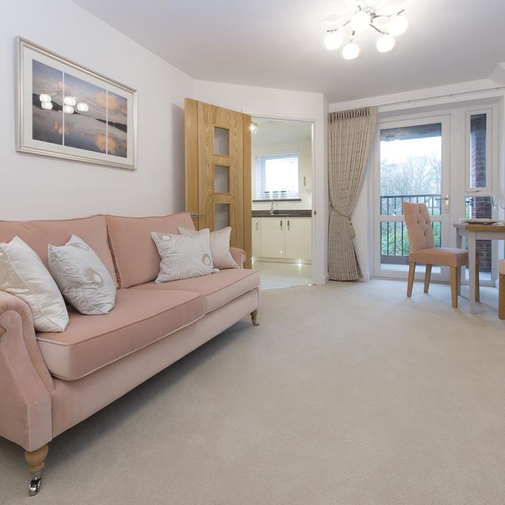 a living room with a couch and chairs