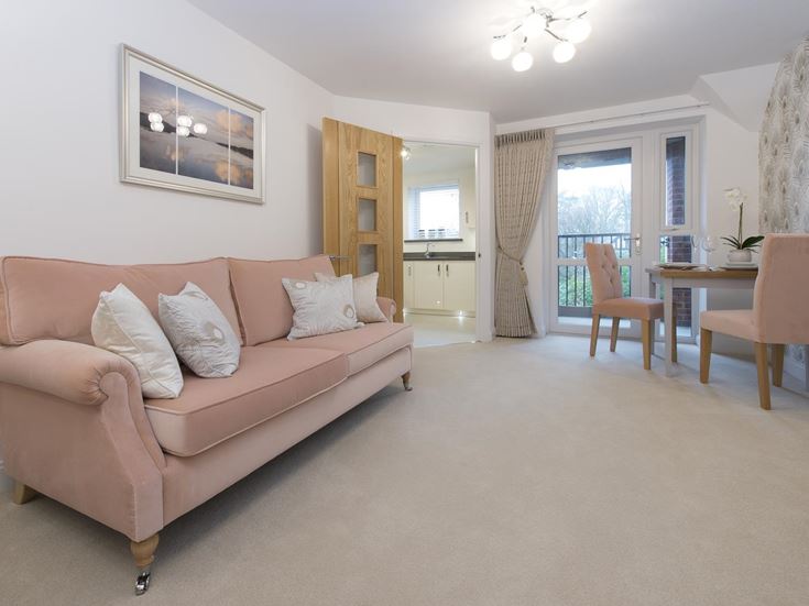a living room with a couch and chairs