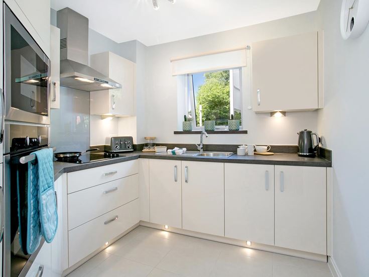 a kitchen with white cabinets